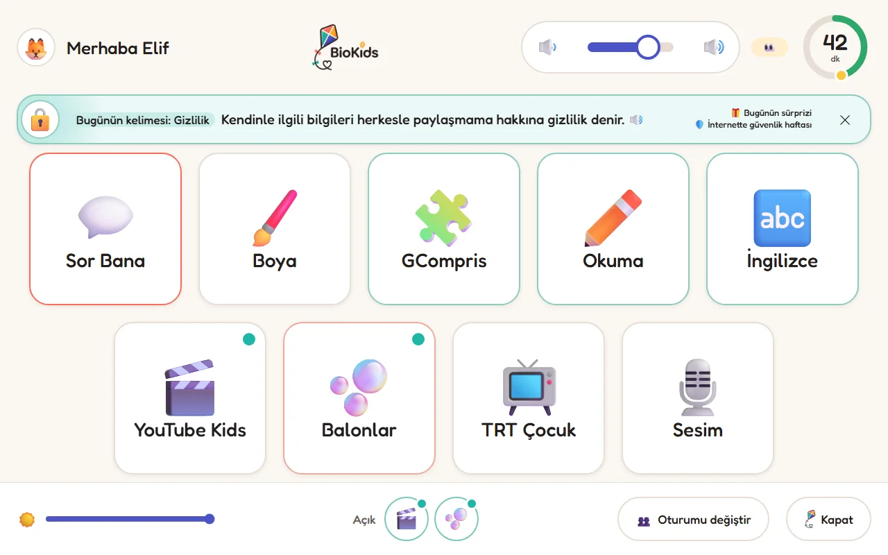 Çocuğun başlatıcısı: Sor Bana, Boya, GCompris, Okuma, İngilizce gibi kocaman kutular; üstte ses ve kalan süre, altta parlaklık ve açık uygulamalar.